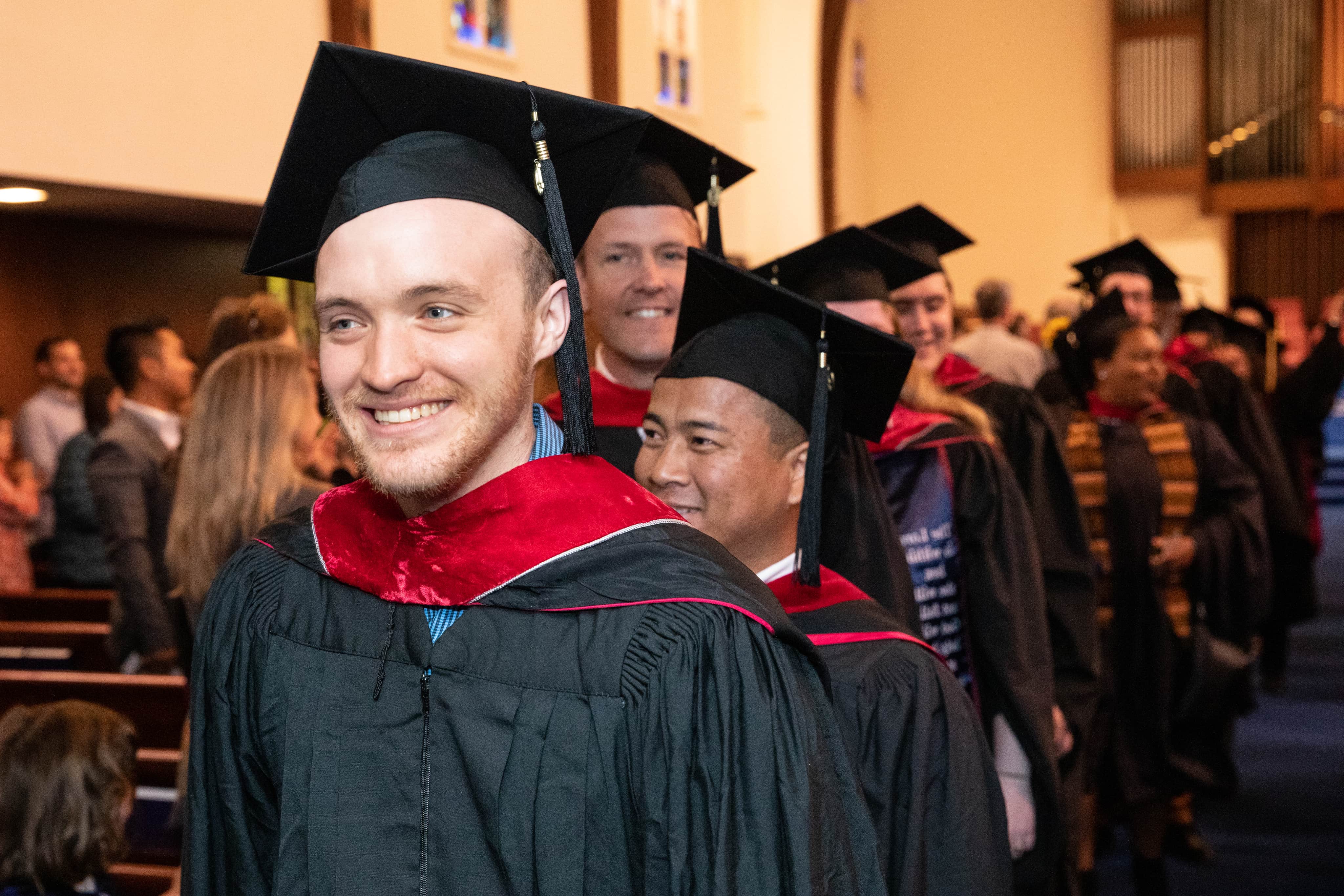 a group of people in graduation gowns