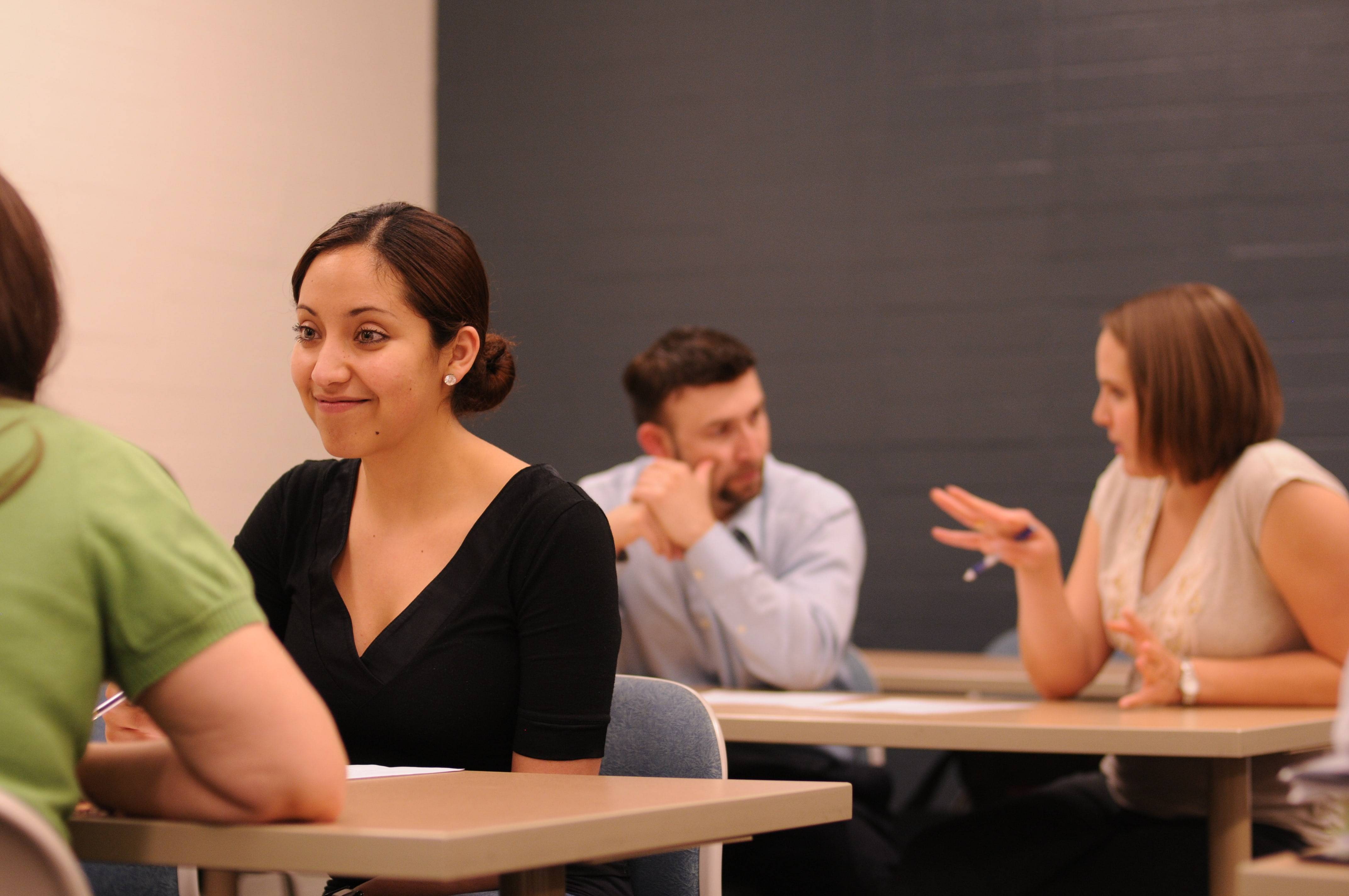 a group of people sitting at desks
